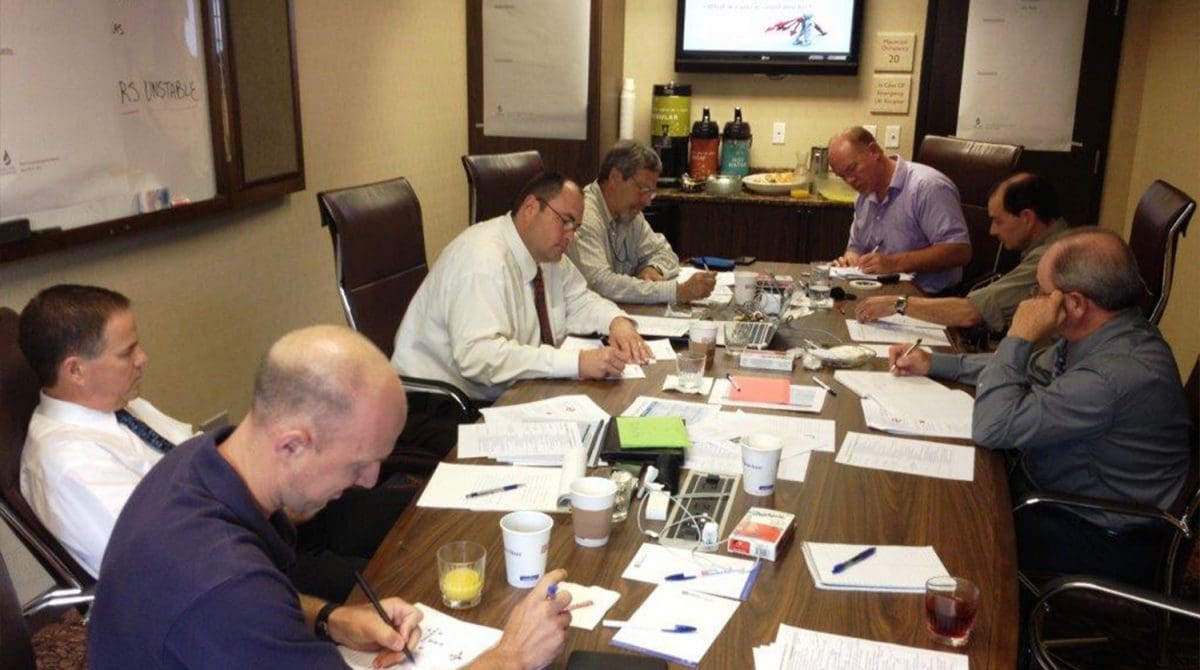 Group of engineers working at a conference table