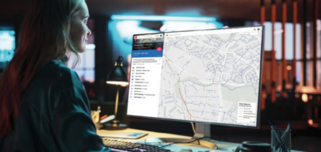 photo of woman looking at a computer screen with a capacity tracking tool
