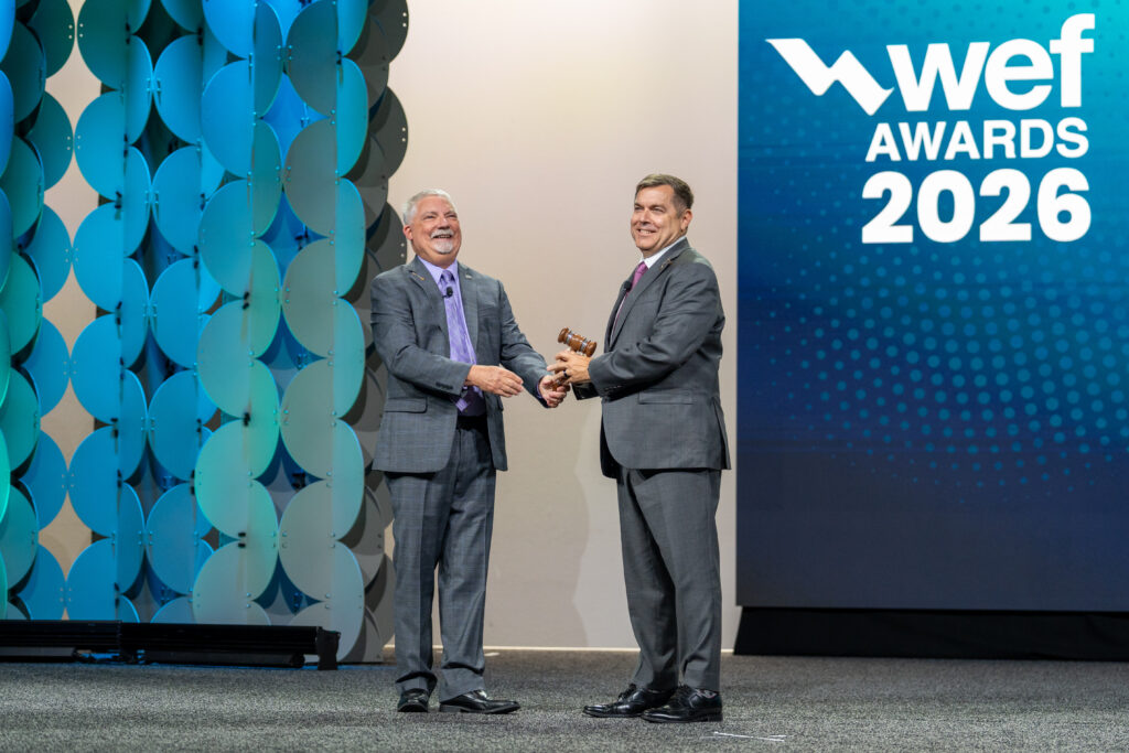 Photo of the 2026 WEF President Paul Schuler on stage at the WEF Awards