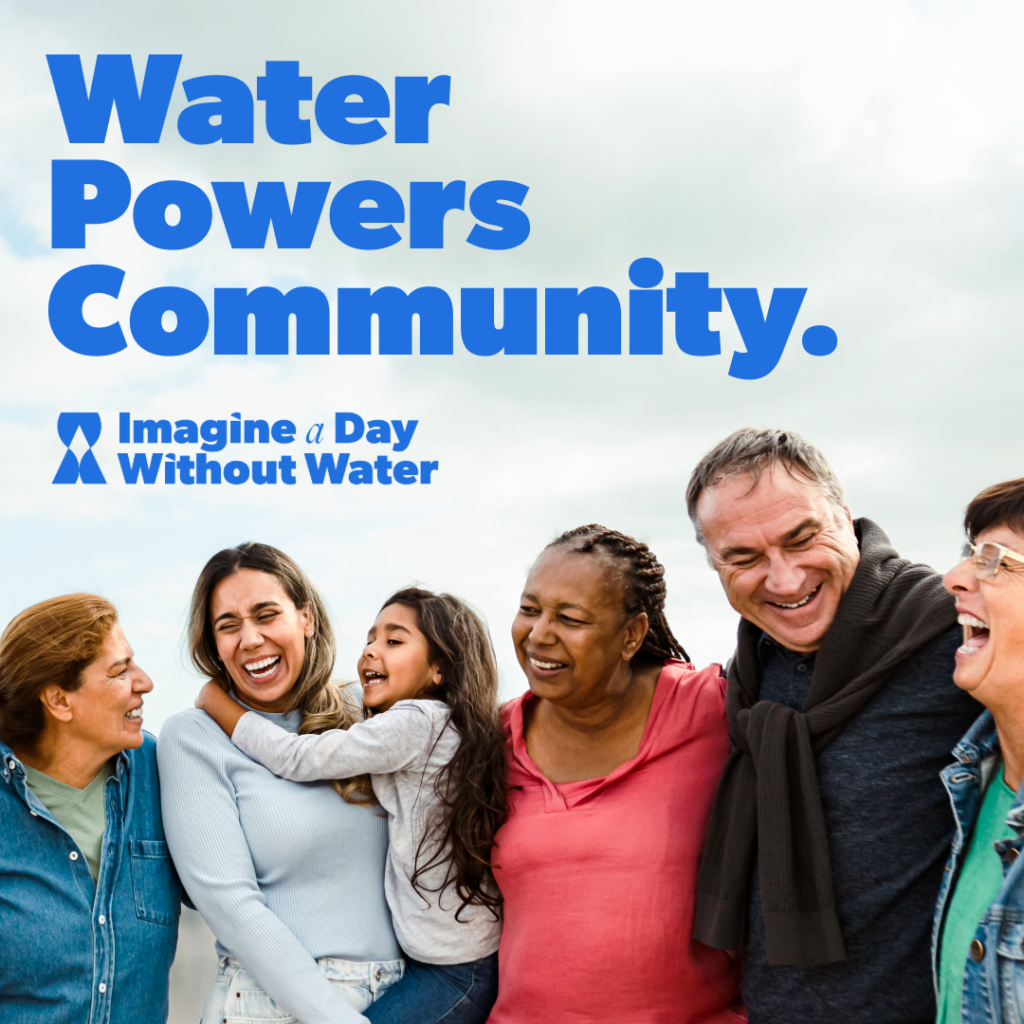 Photo of a group of people standing together with the words "Water Powers Community" for Imagine a Day Without Water.